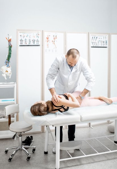 Physical Therapist assisting patient with rehabilitation